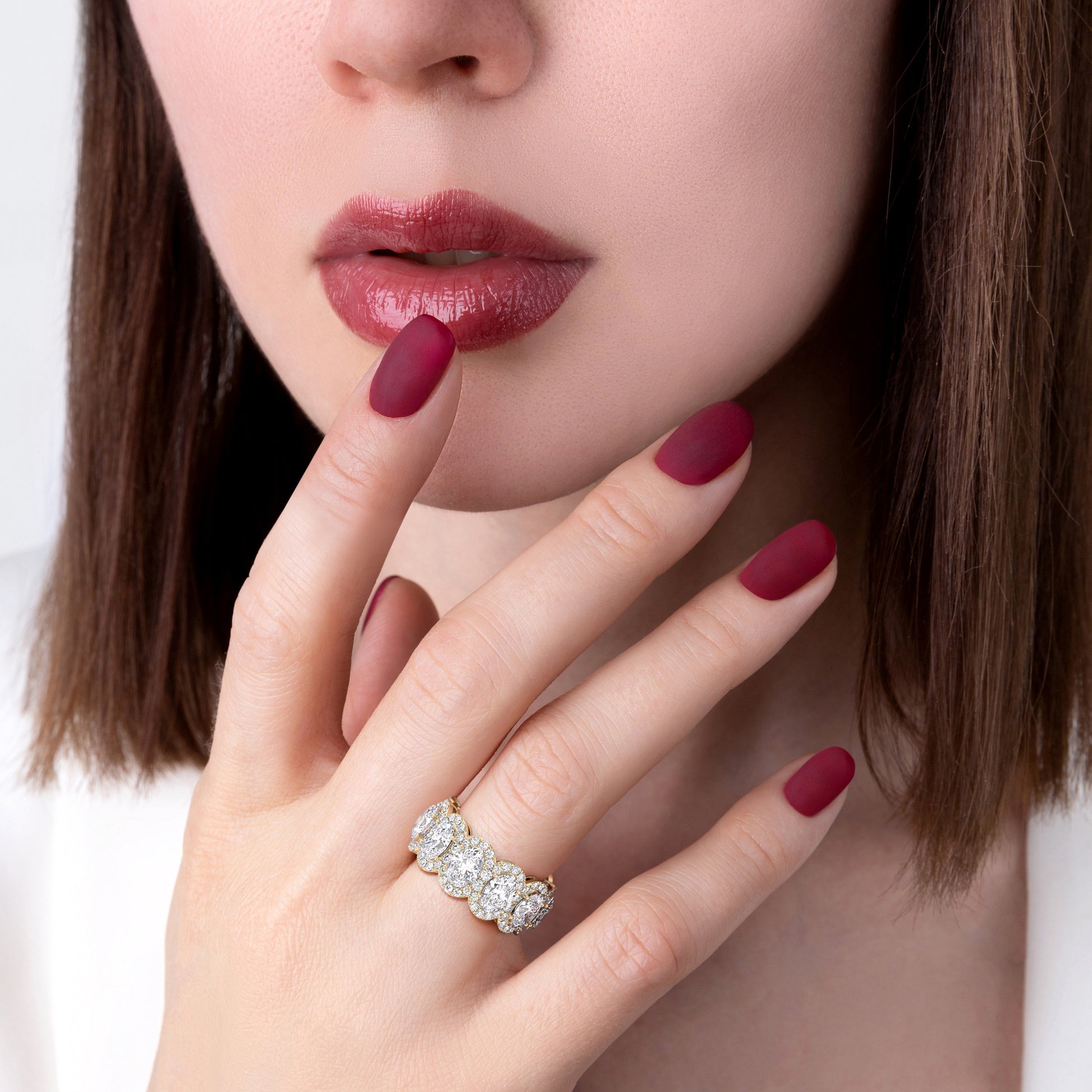 Elegant 14K gold oval eternity wedding band worn on model's hand, featuring a row of diamonds in a unique design. |
 
 
 #14KRecycledYellowGold
 #18KRecycledYellowGold