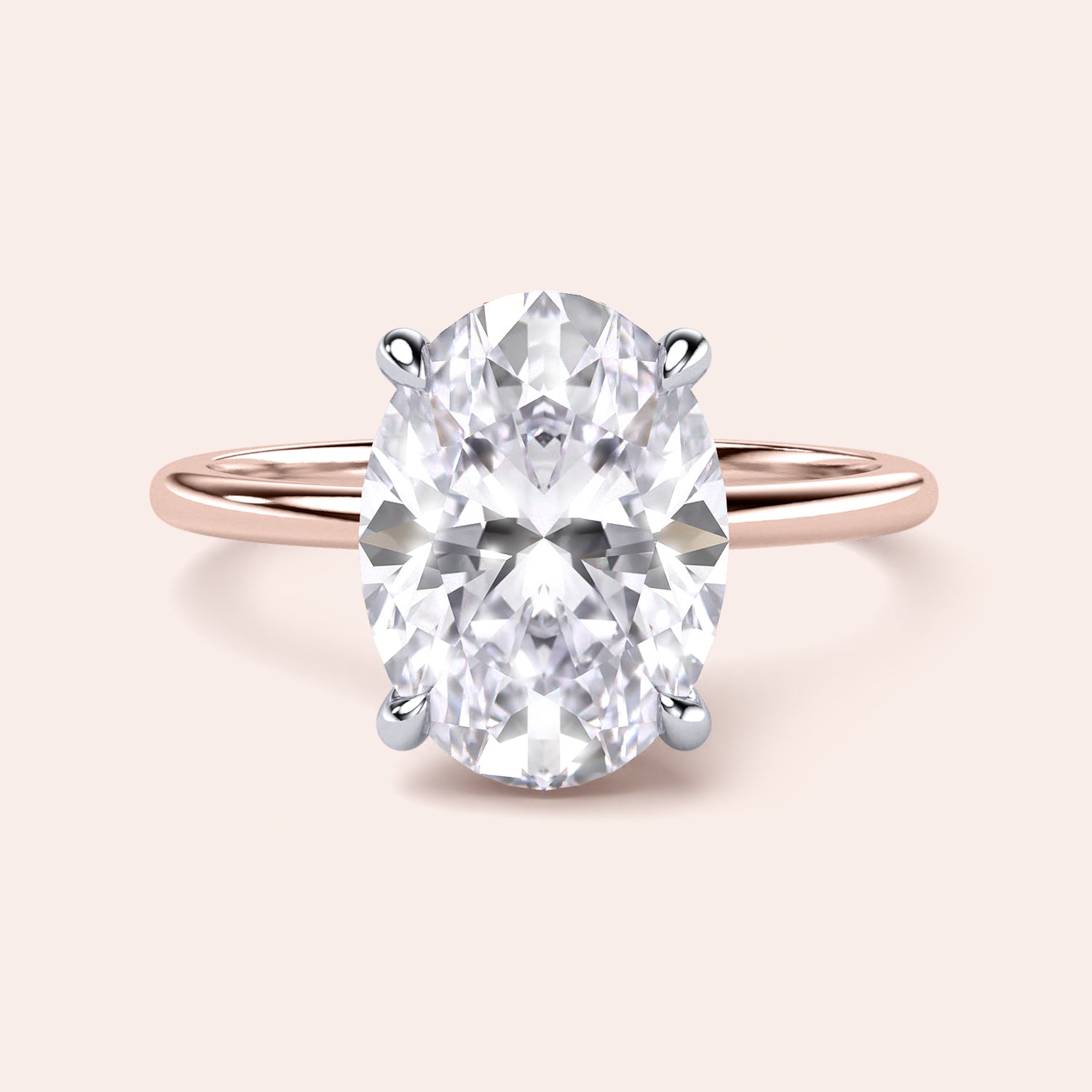 Two-tone oval diamond ring in 14K/18K white and rose gold, featuring a secret halo solitaire design. Perfect for engagements. |
#14KRecycledRose/WhiteGold
#18KRecycledRose/WhiteGold