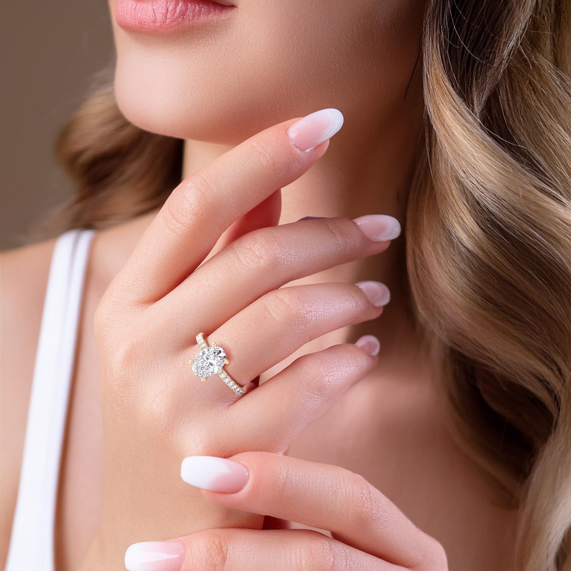 Sparkling cushion-cut diamond engagement ring in 14K, 18K gold, or platinum, elegantly worn, highlighting its brilliance and design.|
#14KRecycledYellowGold 
#18KRecycledYellowGold