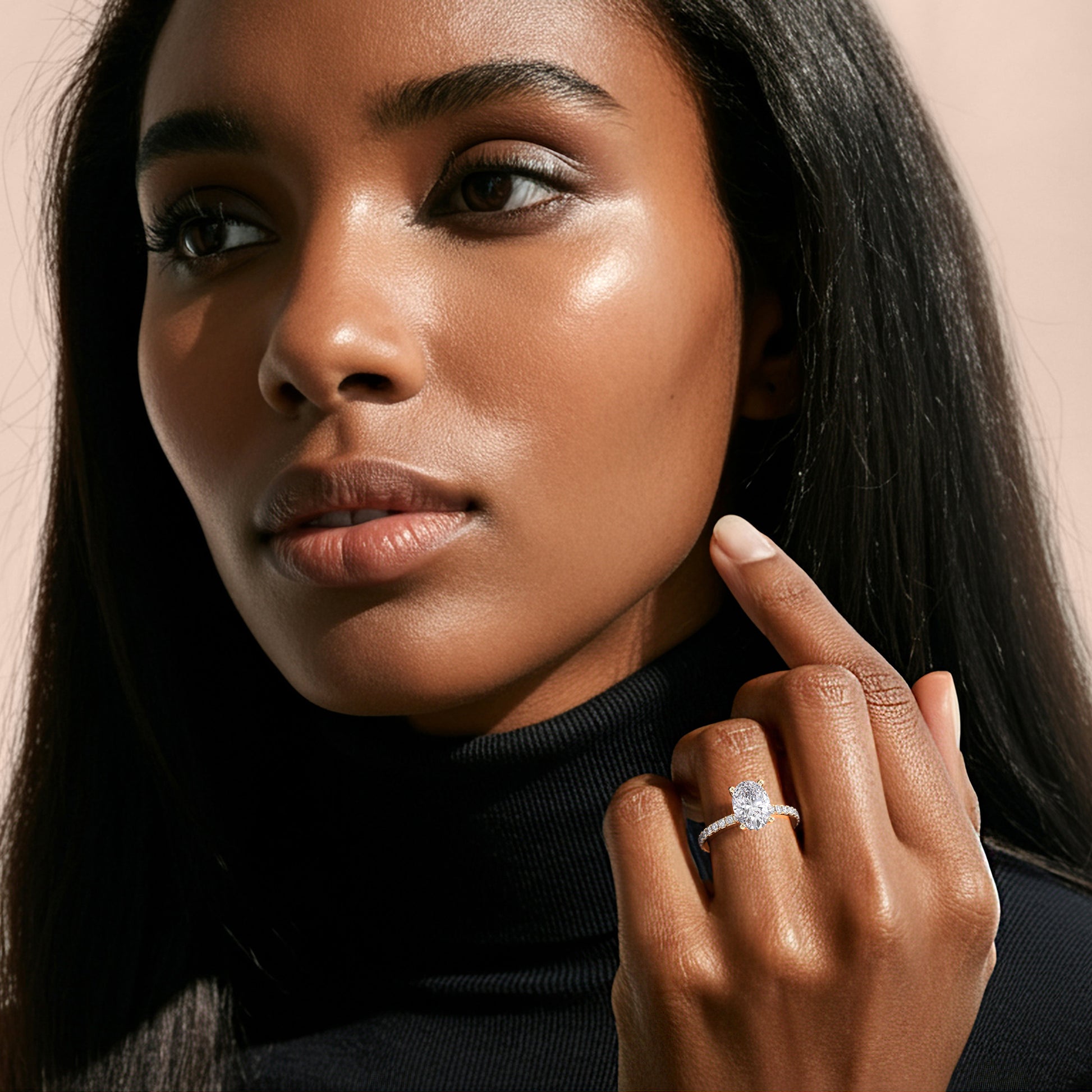 Oval diamond engagement ring in 14K or 18K gold, or platinum, beautifully showcased on a model's finger.|
#14KRecycledYellowGold 
#18KRecycledYellowGold