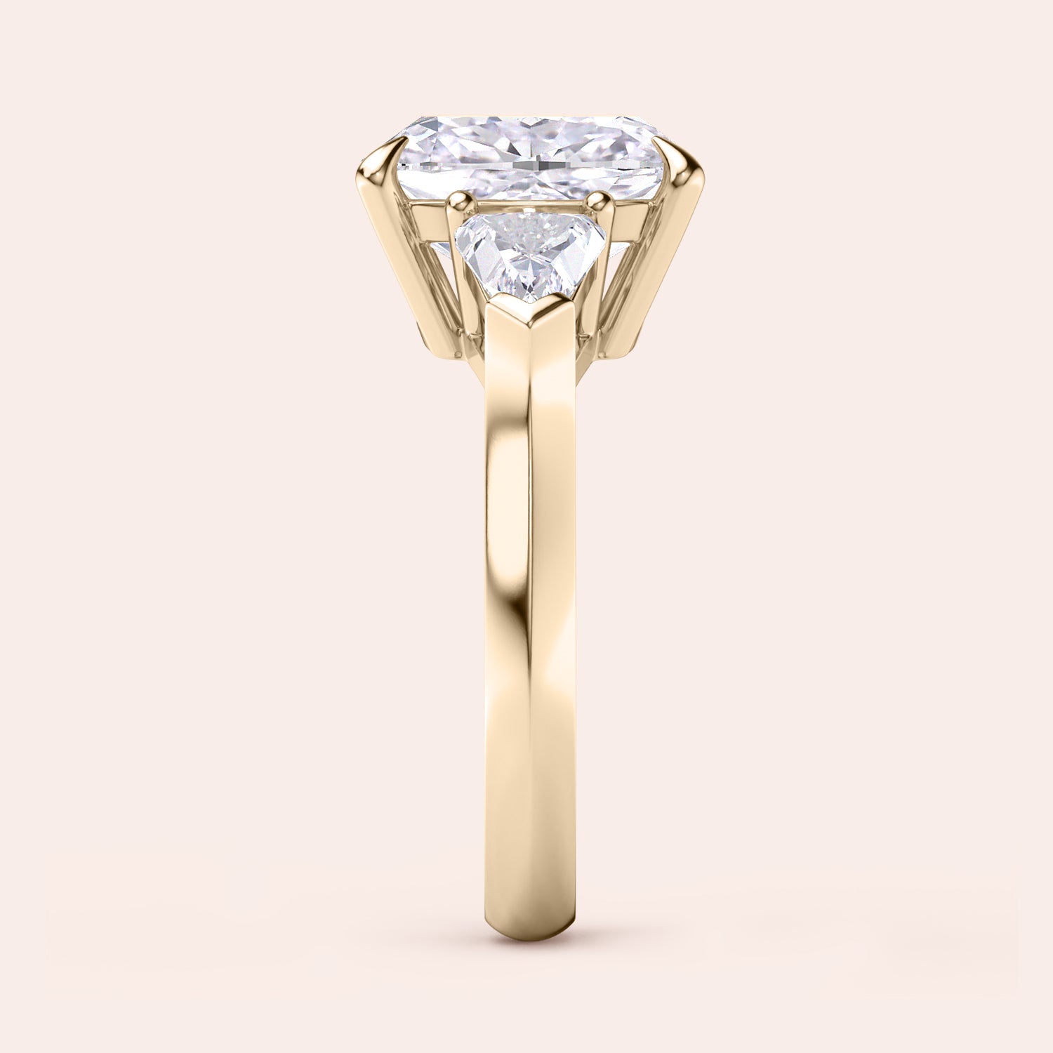 Elegant yellow gold 14K three stone engagement ring featuring a cushion diamond and shield side stones. |
#14KRecycledYellowGold
#18KRecycledYellowGold