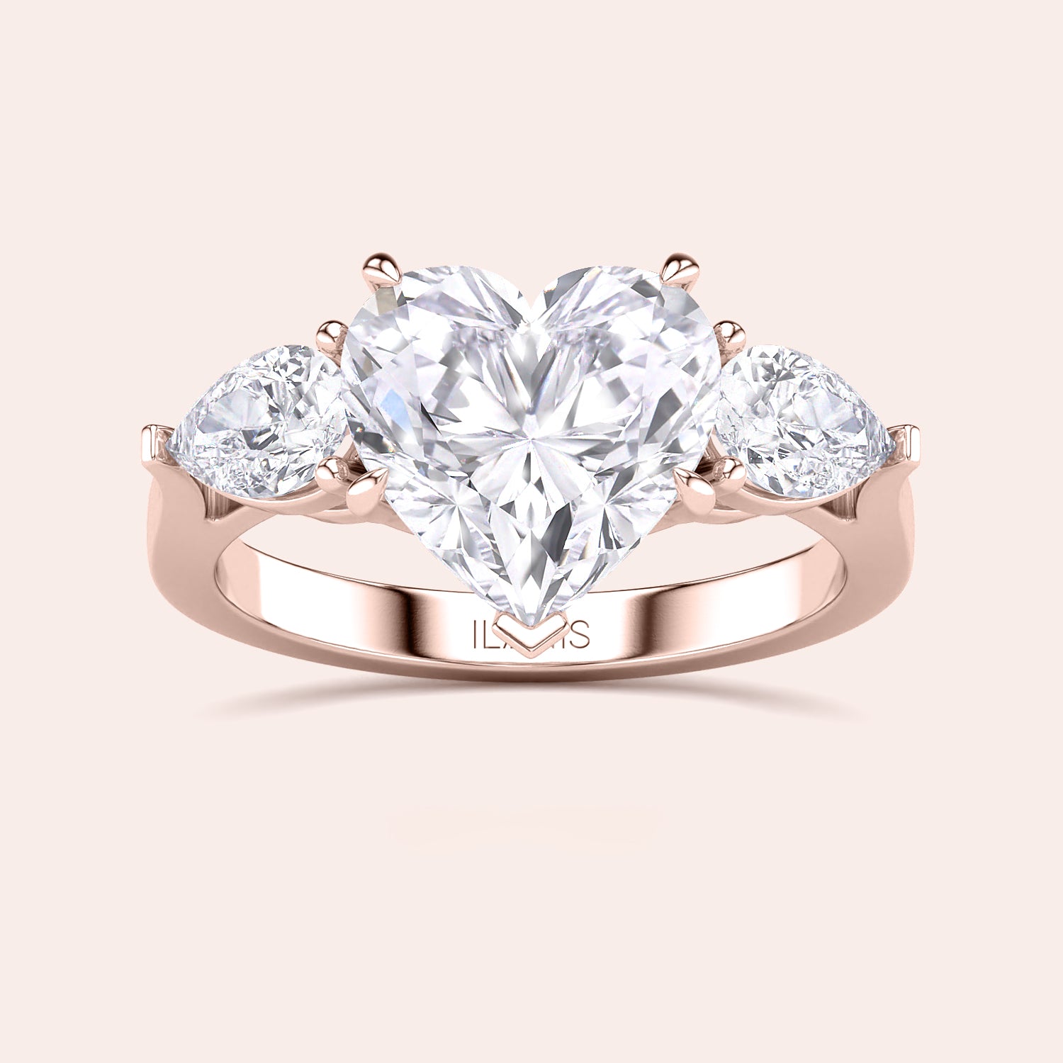 Close-up of a rose gold engagement ring with a heart-shaped diamond center and teardrop diamond accents along the band, reflecting sophisticated craftsmanship. | #14KRecycledRoseGold #18KRecycledRoseGold