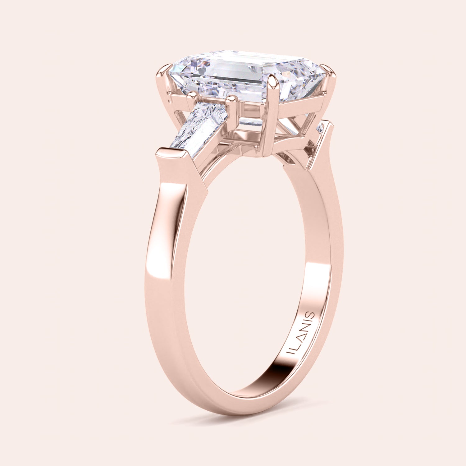 Sophisticated rose gold engagement ring displaying a large emerald-cut center diamond with trapezoid side stones, enhancing its elegant design. | 
#14KRecycledRoseGold #18KRecycledRoseGold