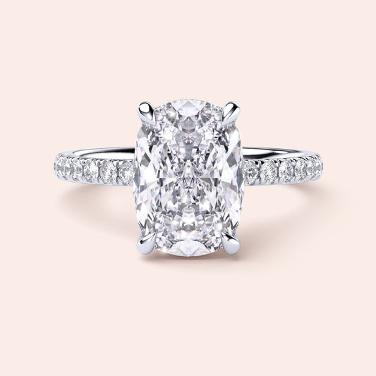 Cushion Cut Diamond Engagement Ring in 14K White Gold with Pave Diamond Band, showcasing a sparkling cushion-shaped center stone.