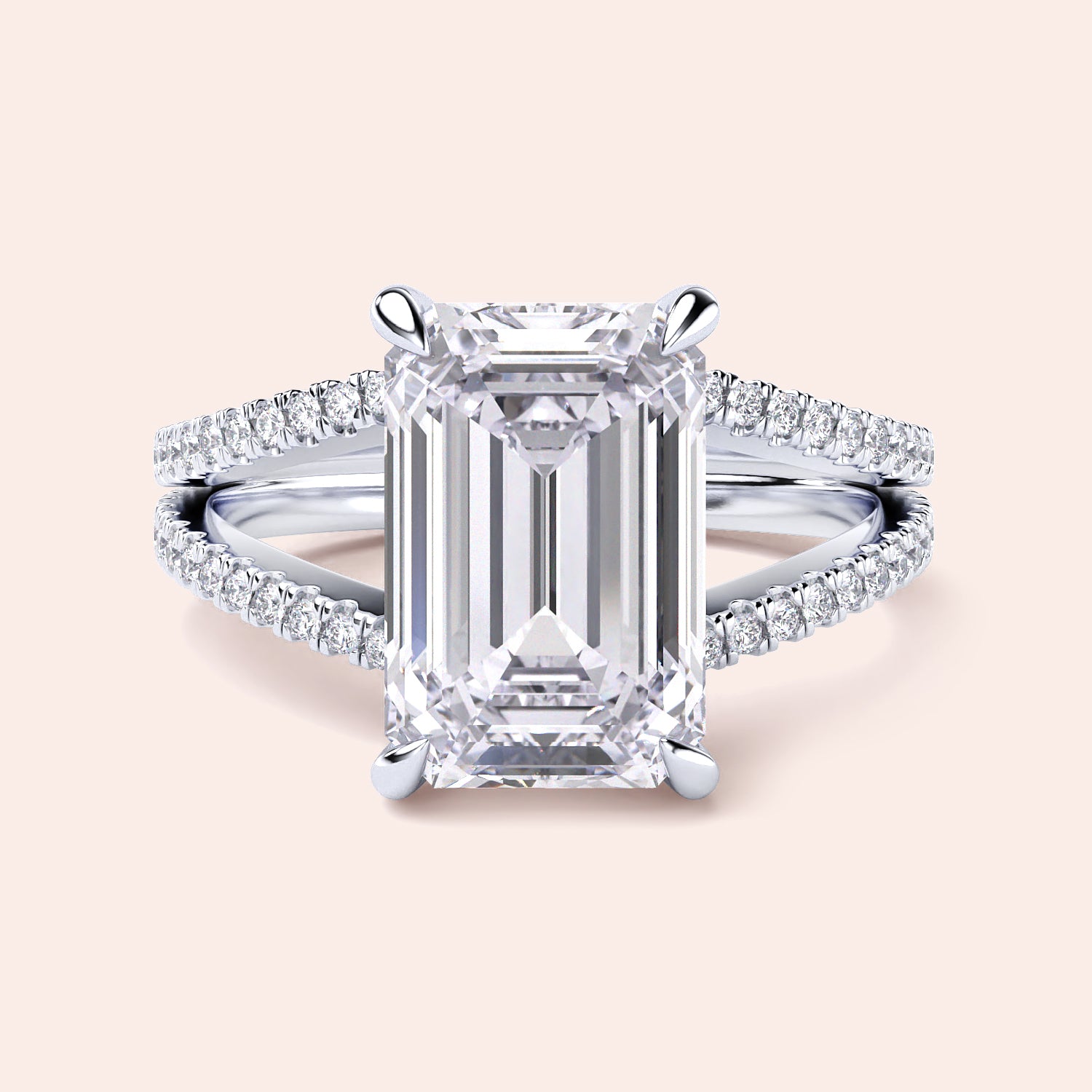 Close-up of an emerald-cut diamond engagement ring with split shank in 14K or 18K white gold, featuring aPave band.|
#14KRecycledWhiteGold
#18KRecycledWhiteGold
#Platinum