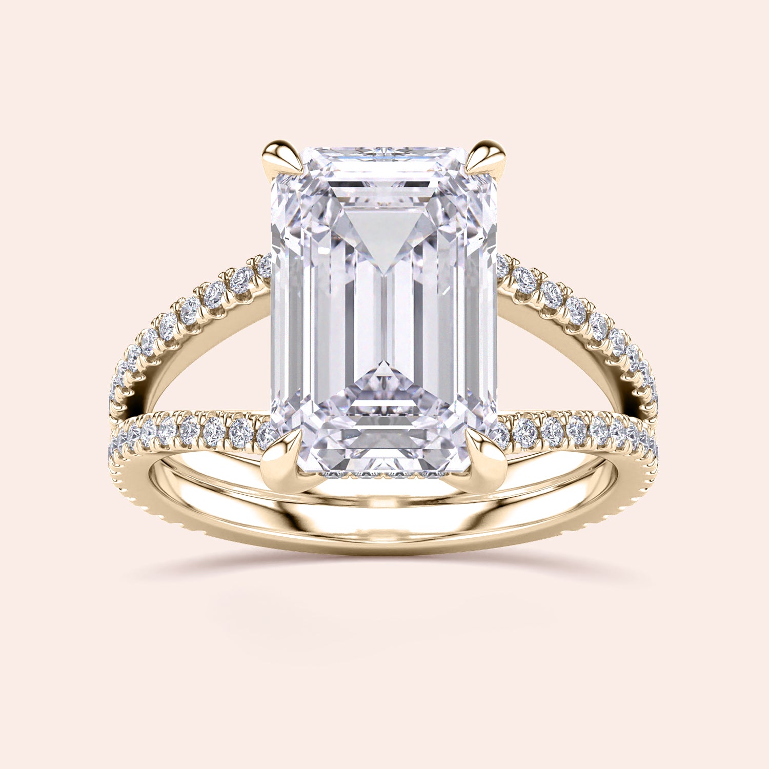 Emerald-cut diamond engagement ring with pave band in 14K or 18K gold, featuring a split shank and hidden halo design.|
#14KRecycledYellowGold
#18KRecycledYellowGold