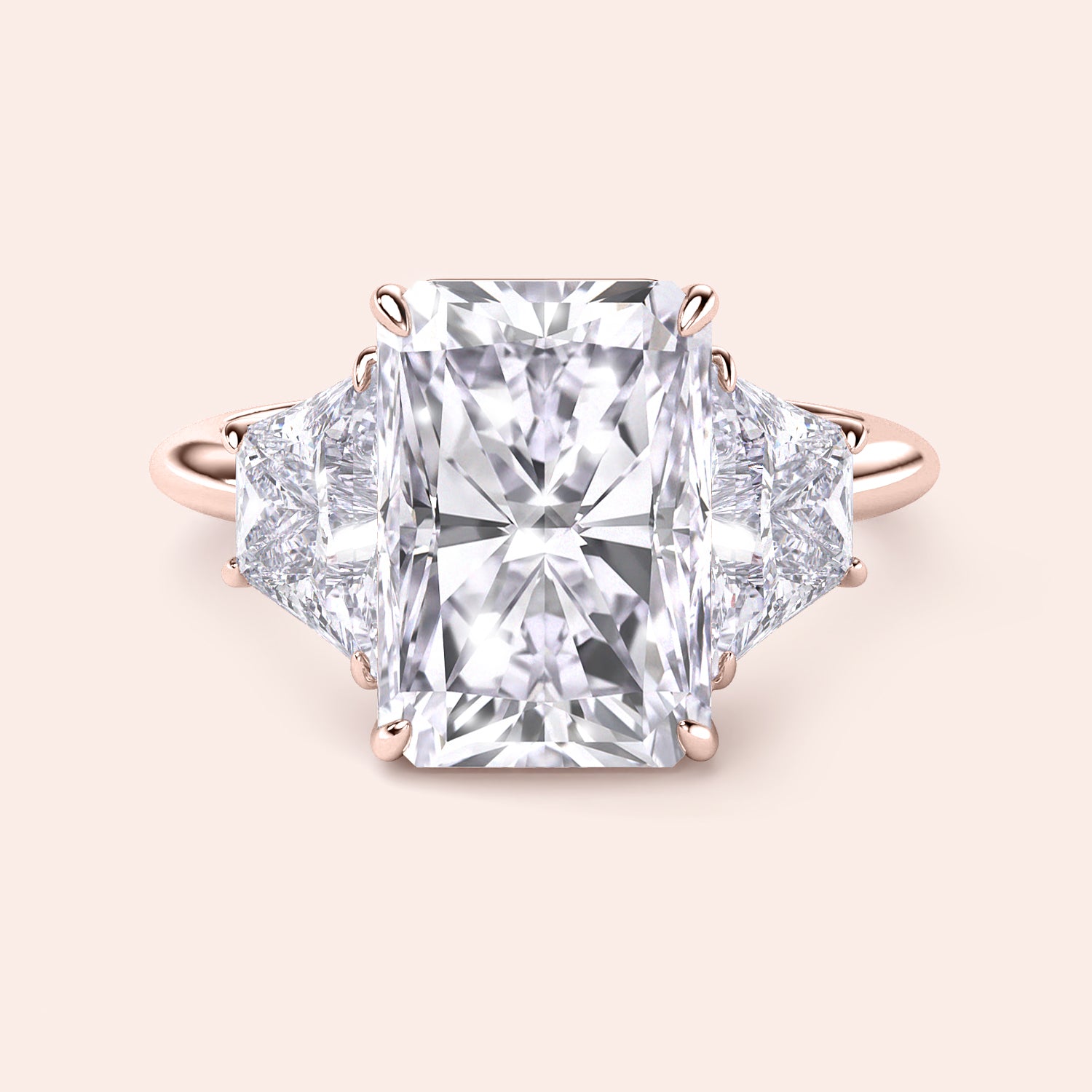 Radiant cut diamond engagement ring in 14K or 18K rose gold, featuring trapezoid side diamonds for a stunning look.|
#14KRecycledRoseGold
#18KRecycledRoseGold