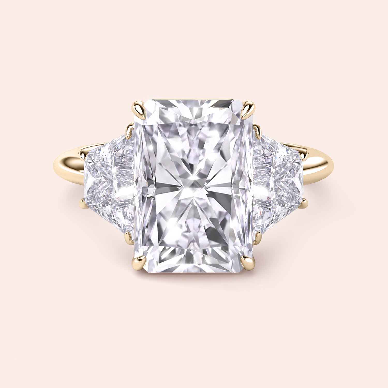 Radiant-cut diamond engagement ring with side stones in 14K gold, showcased against a neutral background.|
#14KRecycledYellowGold
#18KRecycledYellowGold