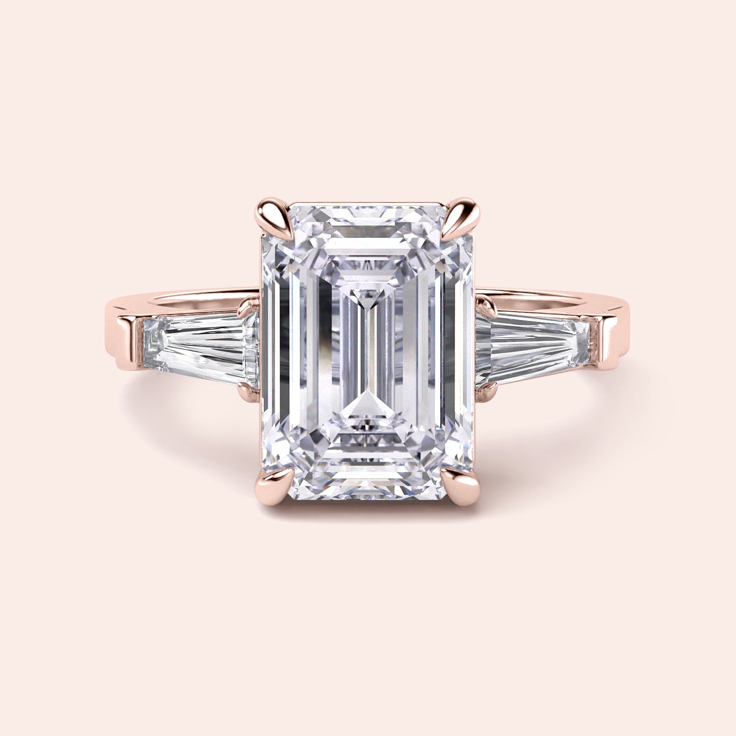Elegant 14K Rose Gold engagement ring featuring emerald cut and tapered baguette diamonds, perfect for timeless beauty.|
#14KRecycledRoseGold
#18KRecycledRoseGold