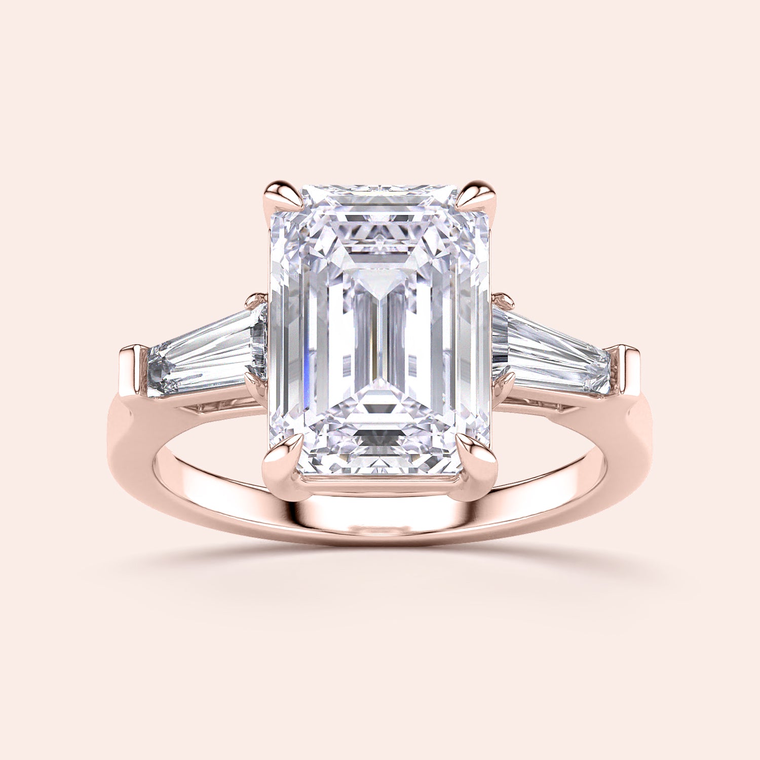 Emerald-cut diamond ring with tapered baguette side stones in 14K rose gold, perfect for elegant engagements.|
#14KRecycledRoseGold
#18KRecycledRoseGold