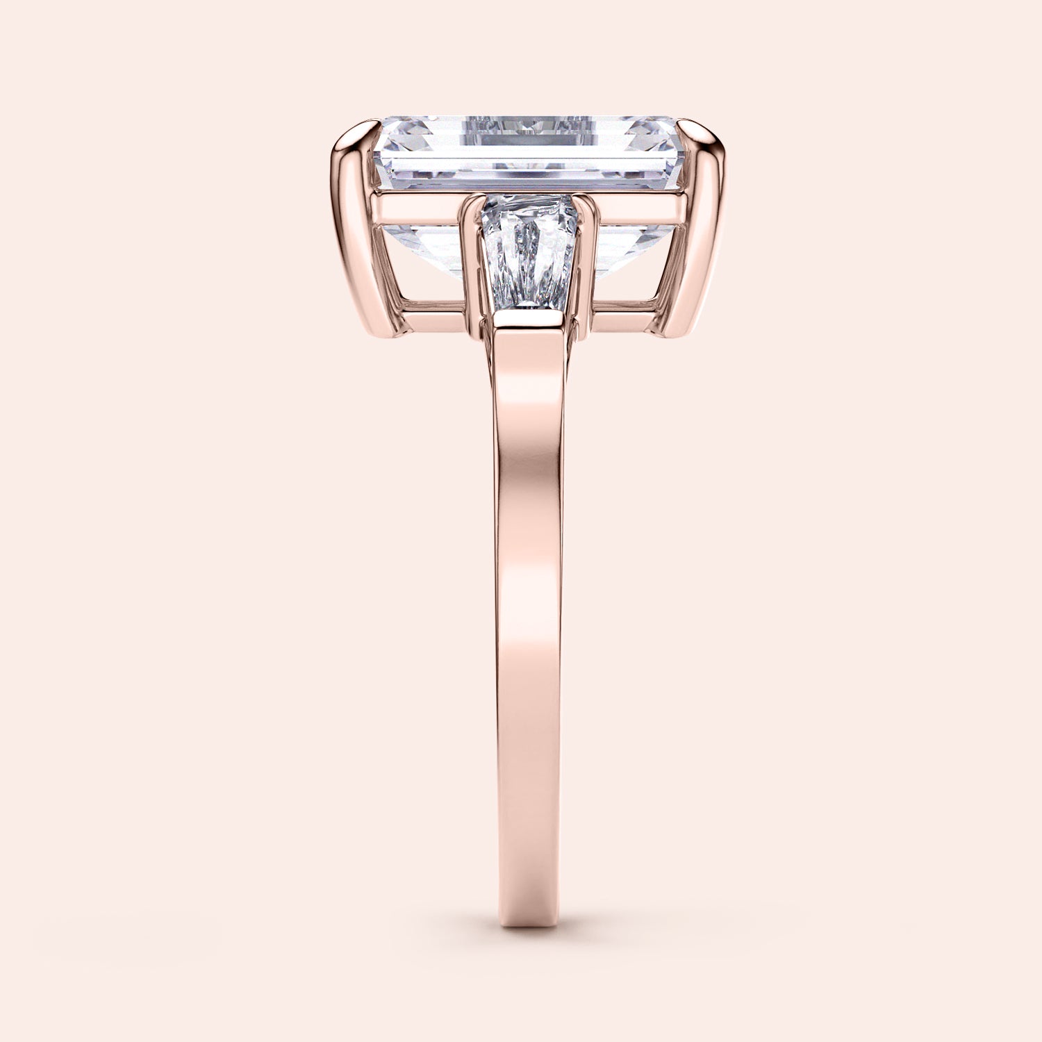 Elegant 14K rose gold engagement ring featuring emerald three stone tapered baguettes for a sophisticated design.|
#14KRecycledRoseGold
#18KRecycledRoseGold