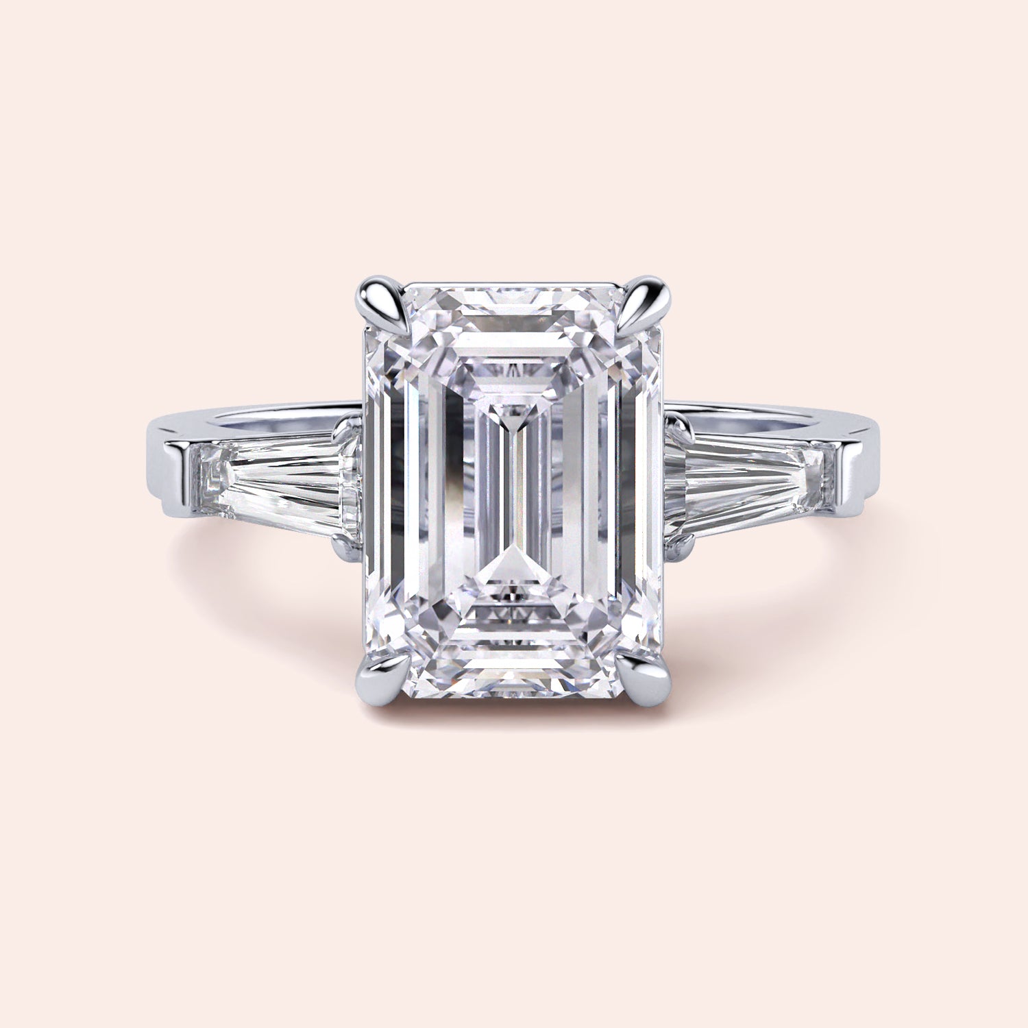Emerald cut diamond ring in 14K or 18K white gold or platinum with tapered baguette side stones for a stunning engagement.|
#14KRecycledWhiteGold
#18KRecycledWhiteGold
#Platinum