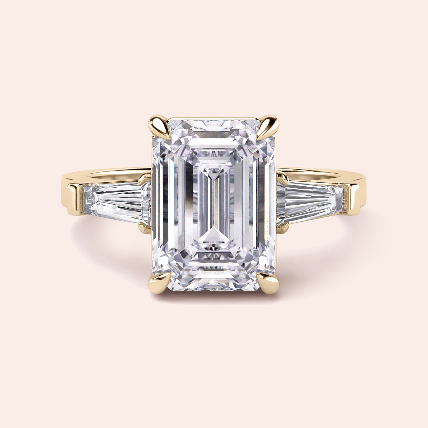 "14K or 18K yellow gold engagement ring with emerald-cut diamond and tapered baguette side stones."|
#14KRecycledYellowGold
#18KRecycledYellowGold