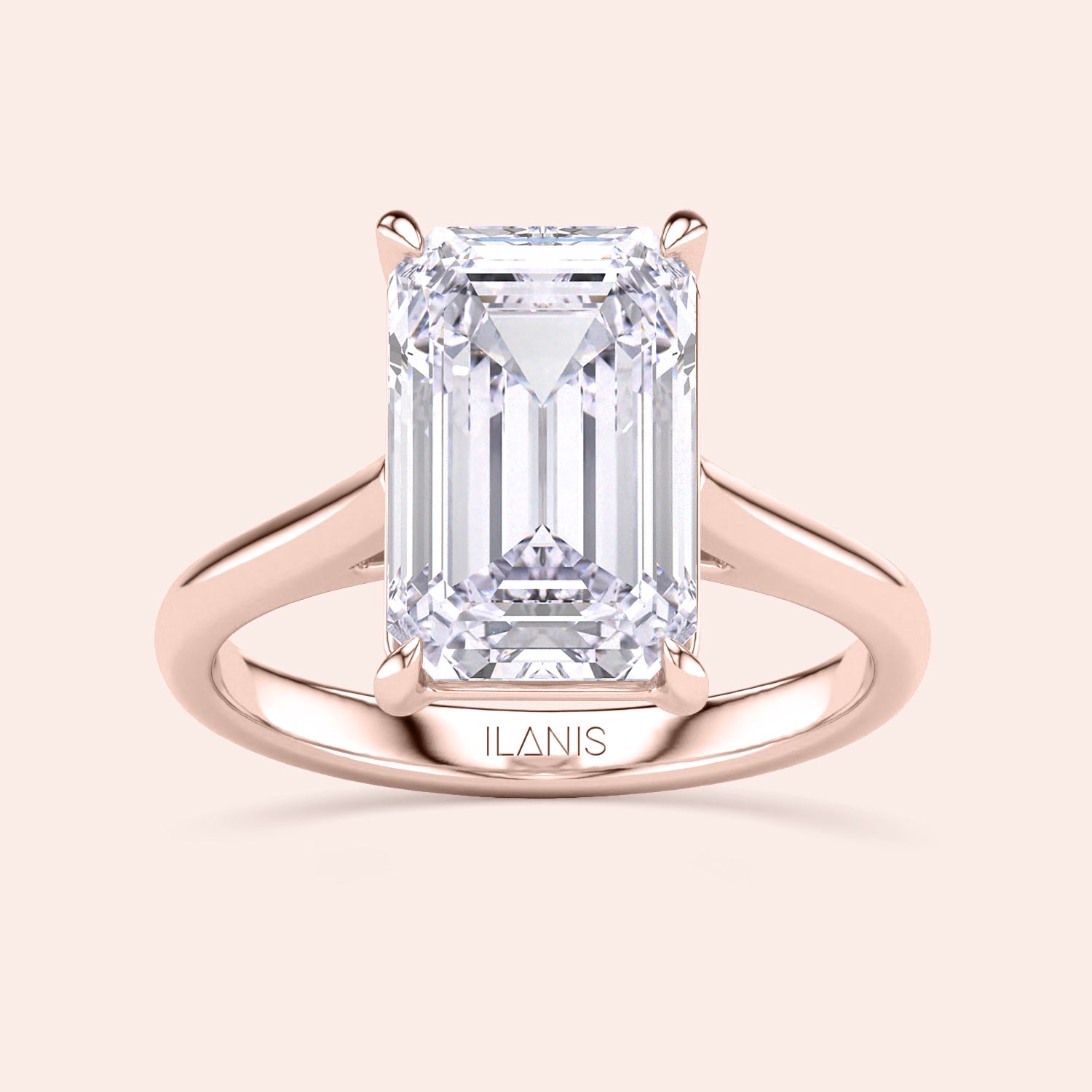 Emerald-cut diamond solitaire engagement ring, set in 14K rose gold, showcased on model for elegant style.|
#14KRecycledRoseGold
#18KRecycledRoseGold