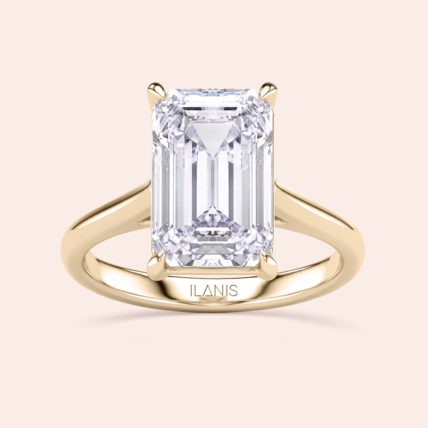 "Elegant 14K yellow gold engagement ring featuring a stunning emerald-cut diamond in a classic cathedral setting by Ilanis."|
#14KRecycledYellowGold
#18KRecycledYellowGold