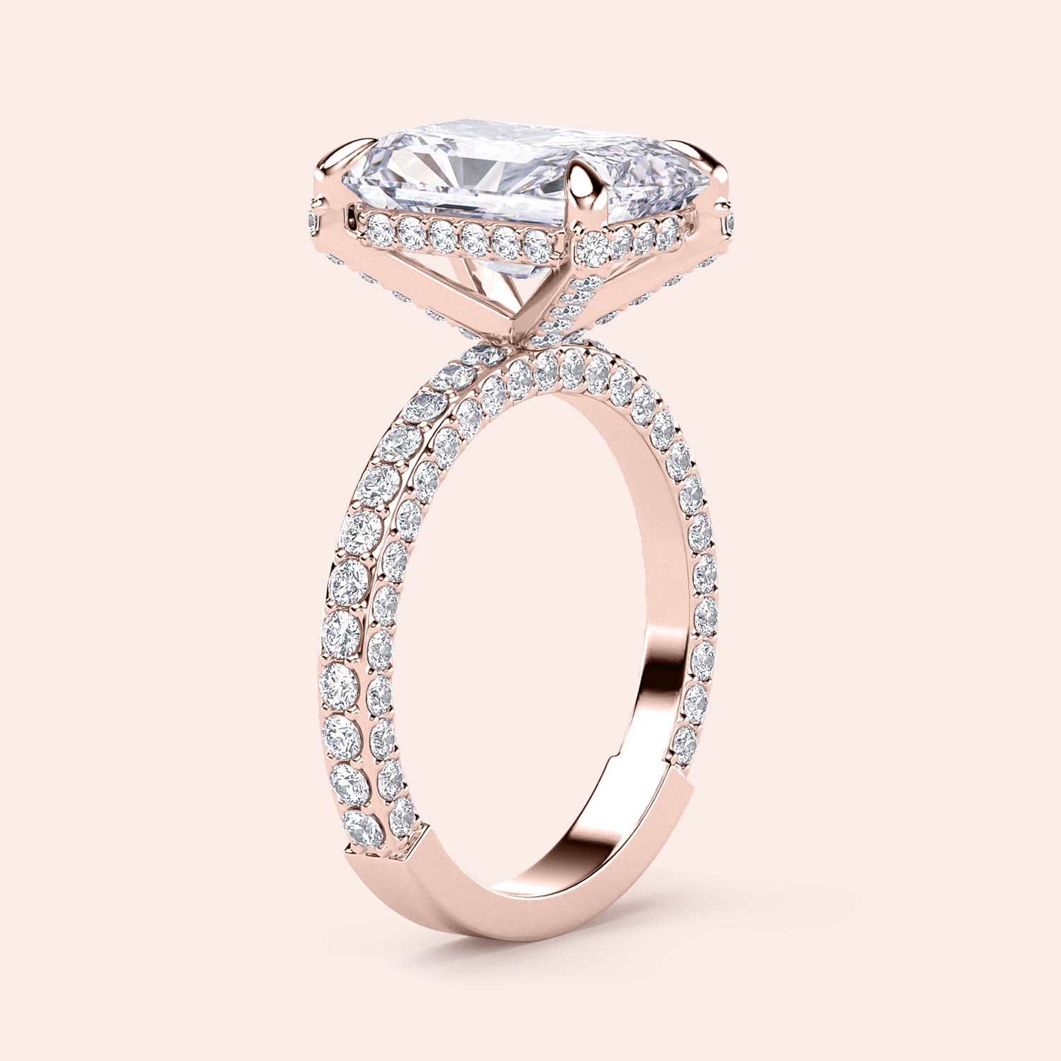 Elegant 14K rose gold engagement ring featuring a radiant-cut diamond and sparklingPave band. Not worn on model.|
#14KRecycledRoseGold
#18KRecycledRoseGold