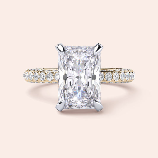 Two-tone 14K/18K white and yellow gold diamond engagement ring with radiant cut, featuring an elegant, timeless design.