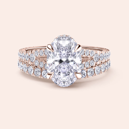Elegant oval-shaped diamond engagement ring with halo, in 14K or 18K gold or platinum, featuring a double-band shank with pave diamonds.