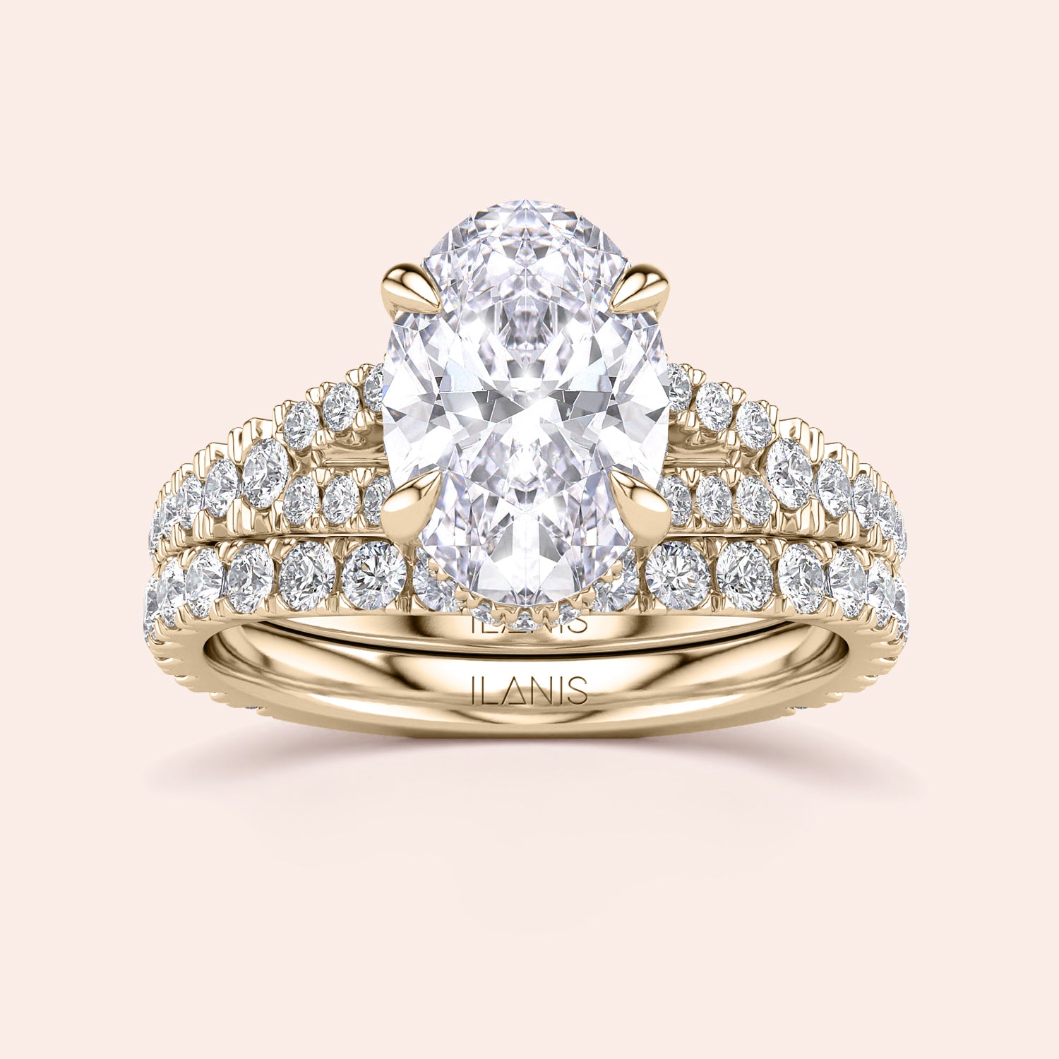 Luxurious oval-shaped diamond engagement ring set in a 14K or 18K gold band, adorned with smaller sparkling diamonds.|
#14KRecycledYellowGold
#18KRecycledYellowGold