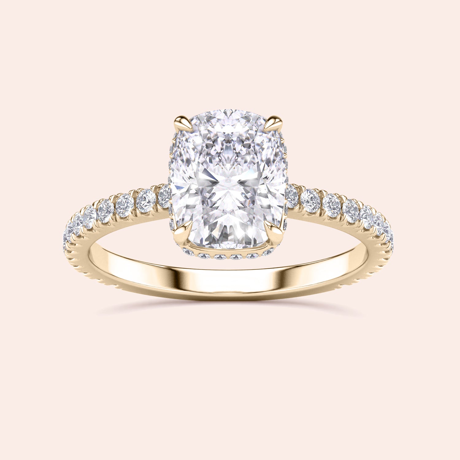 Elegant 14K or 18K gold engagement ring with a cushion-cut diamond center and side stones, showcasing timeless sophistication.|
#14KRecycledYellowGold
#18KRecycledYellowGold