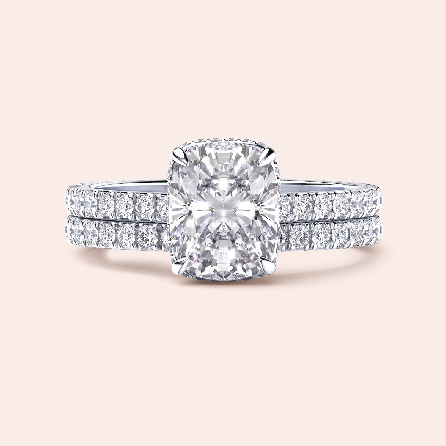 Elegant cushion-cut diamond engagement ring in 14K or 18K gold with dualPave bands, showcasing exceptional brilliance.|
#14KRecycledWhiteGold
#18KRecycledWhiteGold
#Platinum