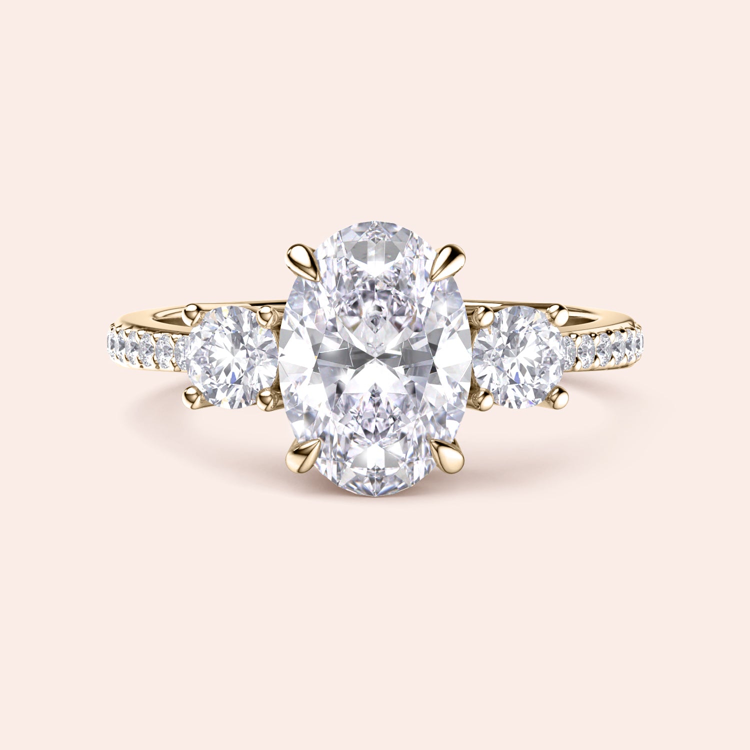 Elegant three-stone engagement ring with oval-cut diamond and round-cut stones in 14K yellow gold or platinum, featuring aPave band.|
#14KRecycledYellowGold
#18KRecycledYellowGold