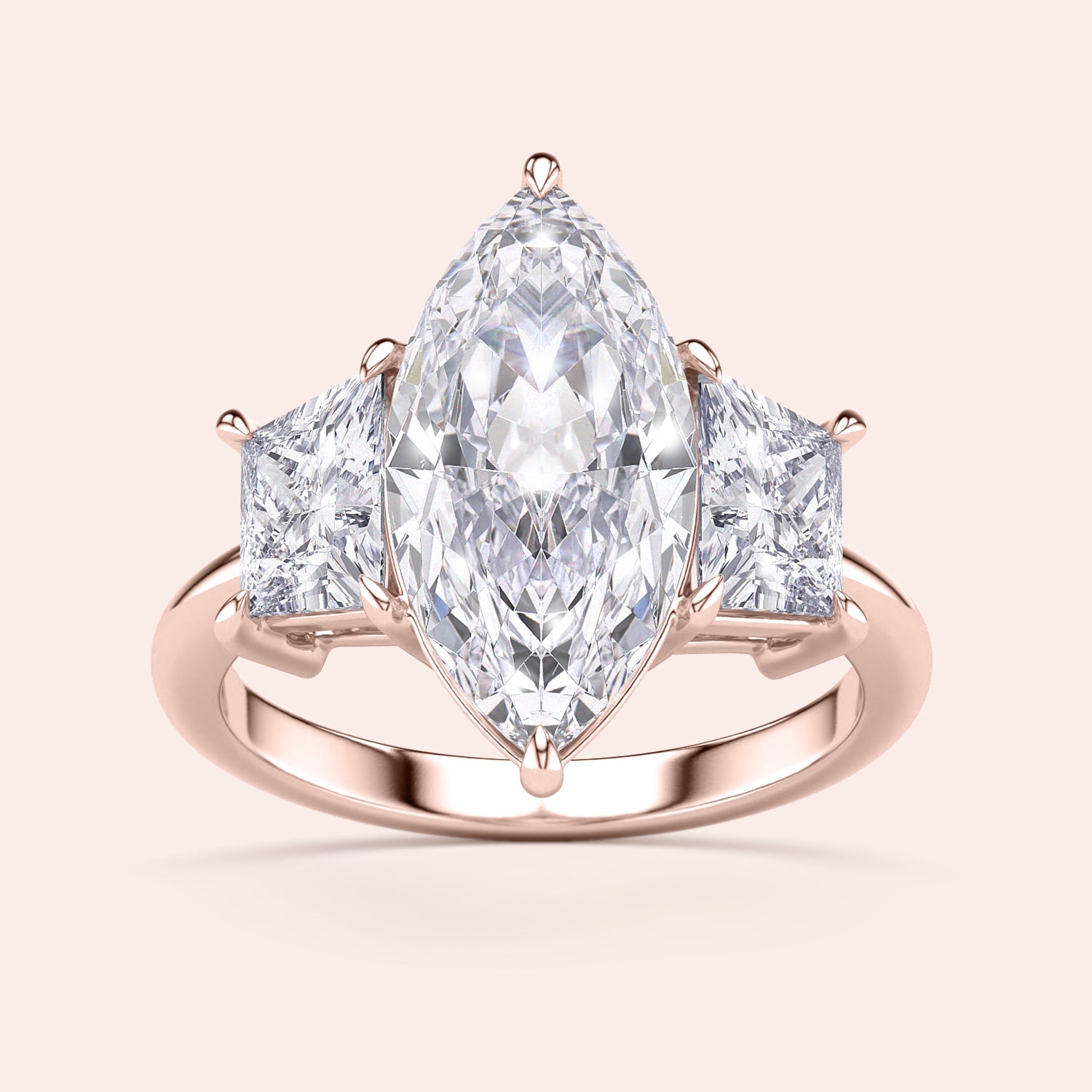 Rose gold engagement ring featuring a marquise-cut diamond and two princess-cut diamonds, available in 14K, 18K, or platinum.|
#14KRecycledRoseGold
#18KRecycledRoseGold