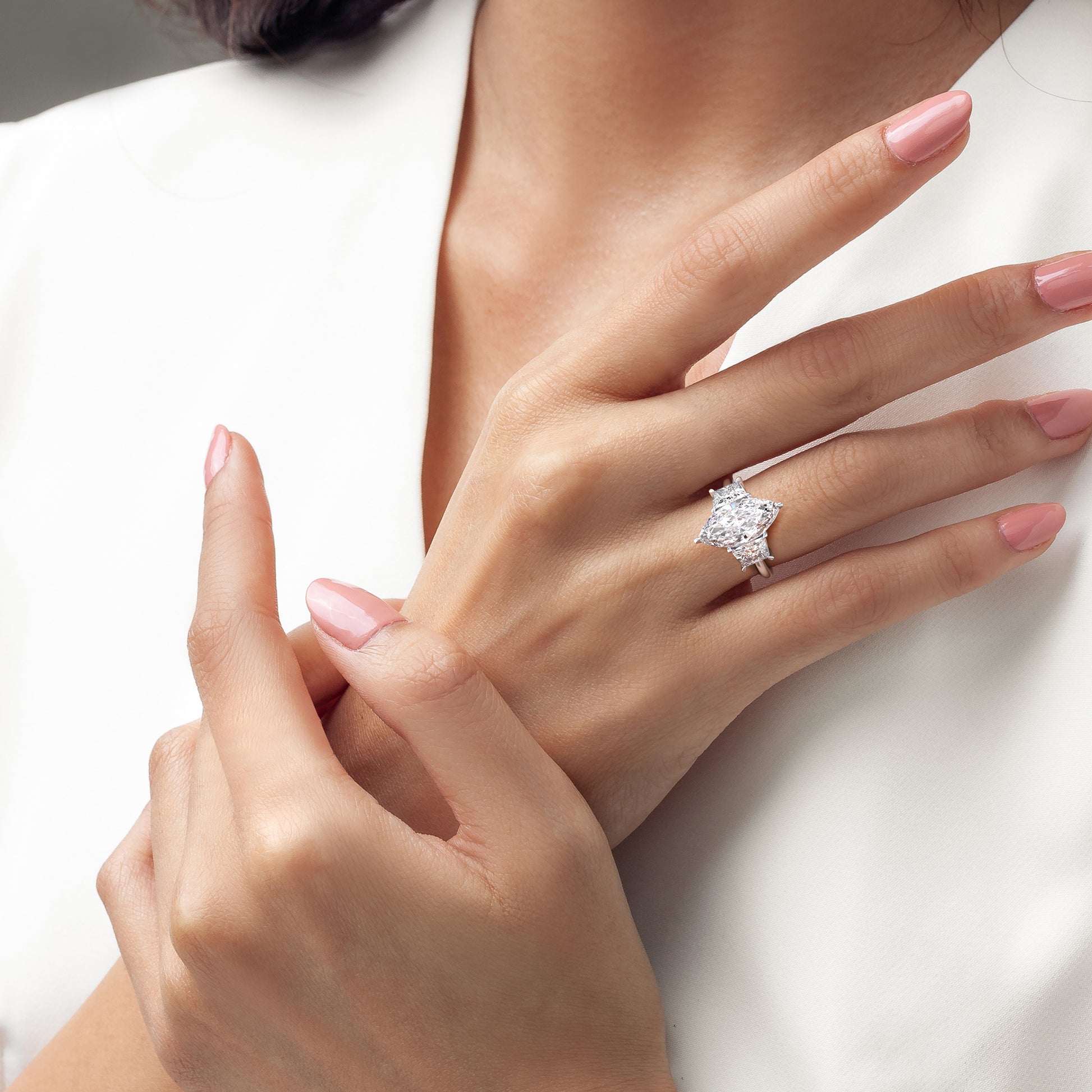 Elegant 14K white gold marquise three-stone ring worn on model, showcasing exquisite craftsmanship and stunning sparkle.|
#14KRecycledWhiteGold
#18KRecycledWhiteGold
#Platinum