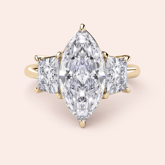 Elegant 14K yellow gold engagement ring with marquise diamond and two princess-cut diamonds for a stunning sparkle.