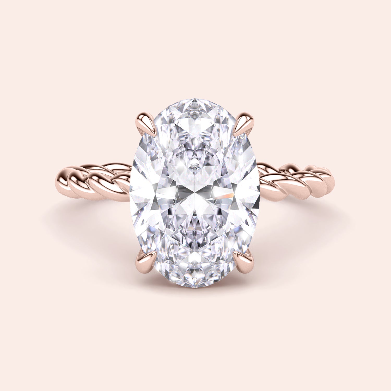 Elegant 14K rose gold oval twisted band ring featuring a dazzling diamond solitaire, perfect for engagement or special occasions.|
#14KRecycledRoseGold
#18KRecycledRoseGold