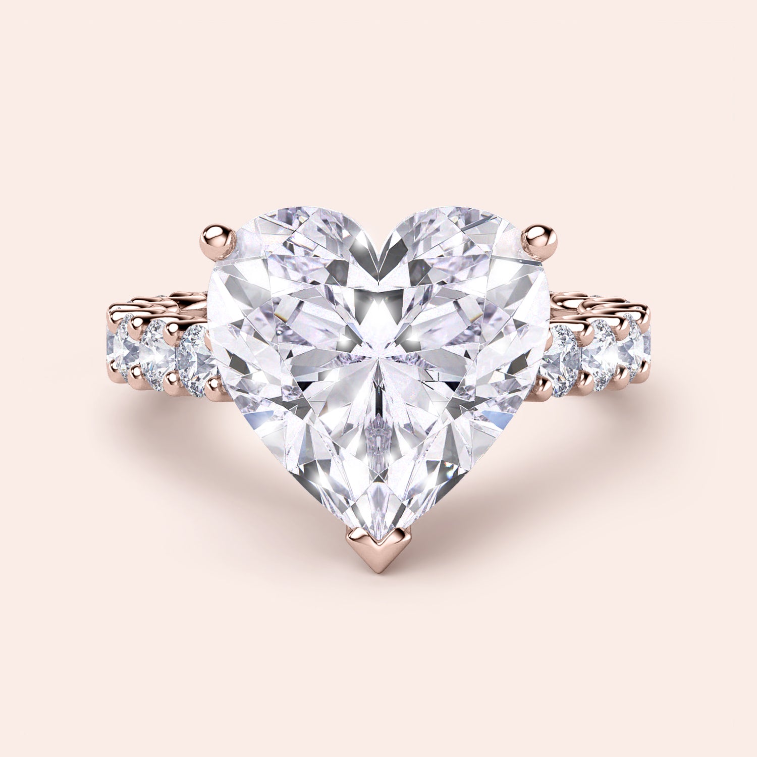 Exquisite heart-shaped diamond engagement ring in 14K rose gold, featuring a large central diamond and sparkling accents.|
#14KRecycledRoseGold
#18KRecycledRoseGold