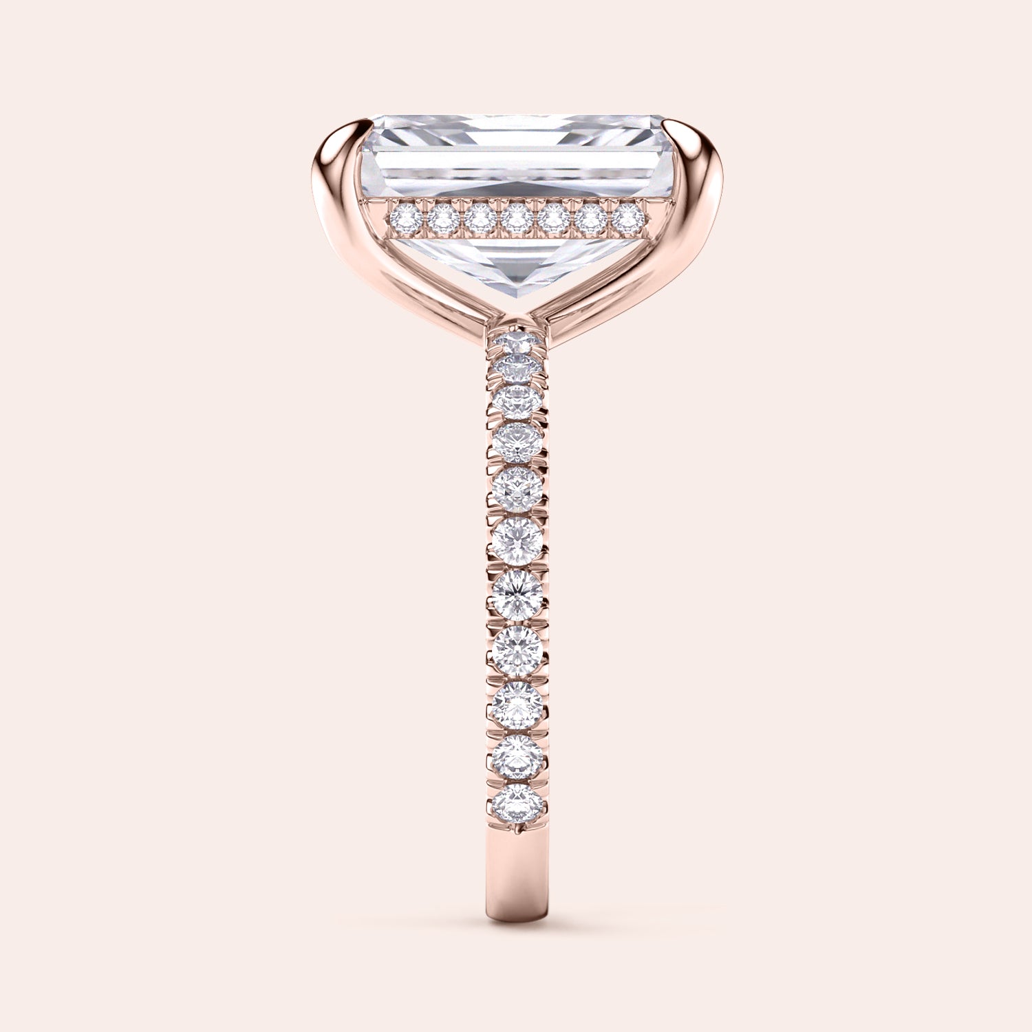 Elegant 14K rose gold engagement ring featuring a radiant cut diamond on a pave band, beautifully worn on a model.|
#14KRecycledRoseGold
#18KRecycledRoseGold