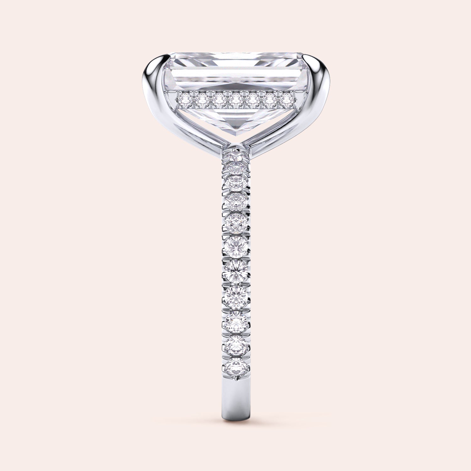 Elegant 14K/18K platinum engagement ring with emerald-cut diamond, side view showcasing a radiantPave diamond band.|
#14KRecycledWhiteGold
#18KRecycledWhiteGold
#Platinum