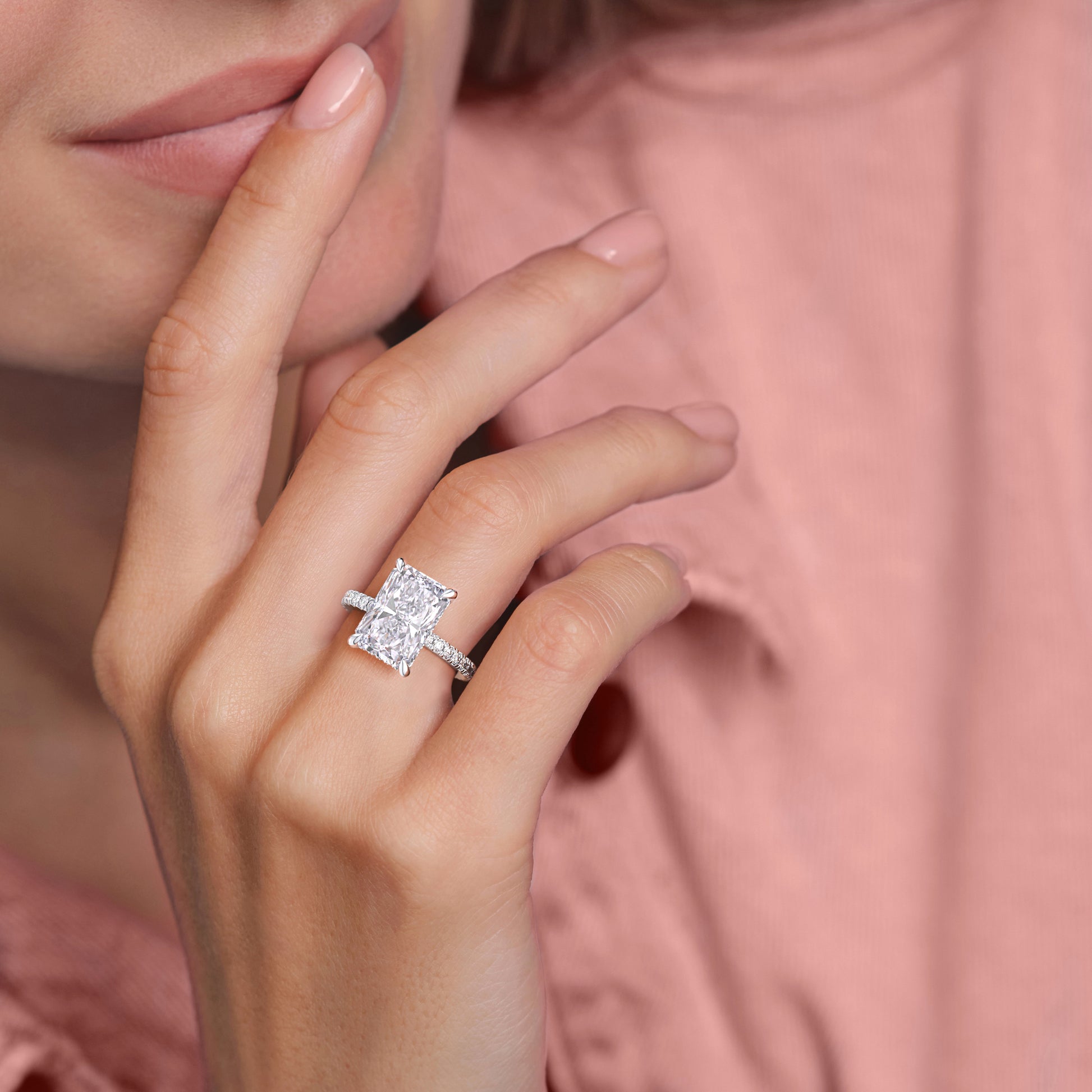 Elegant 14K/18K engagement ring featuring a stunning square-shaped diamond, worn on a model's finger.|
#14KRecycledWhiteGold
#18KRecycledWhiteGold
#Platinum