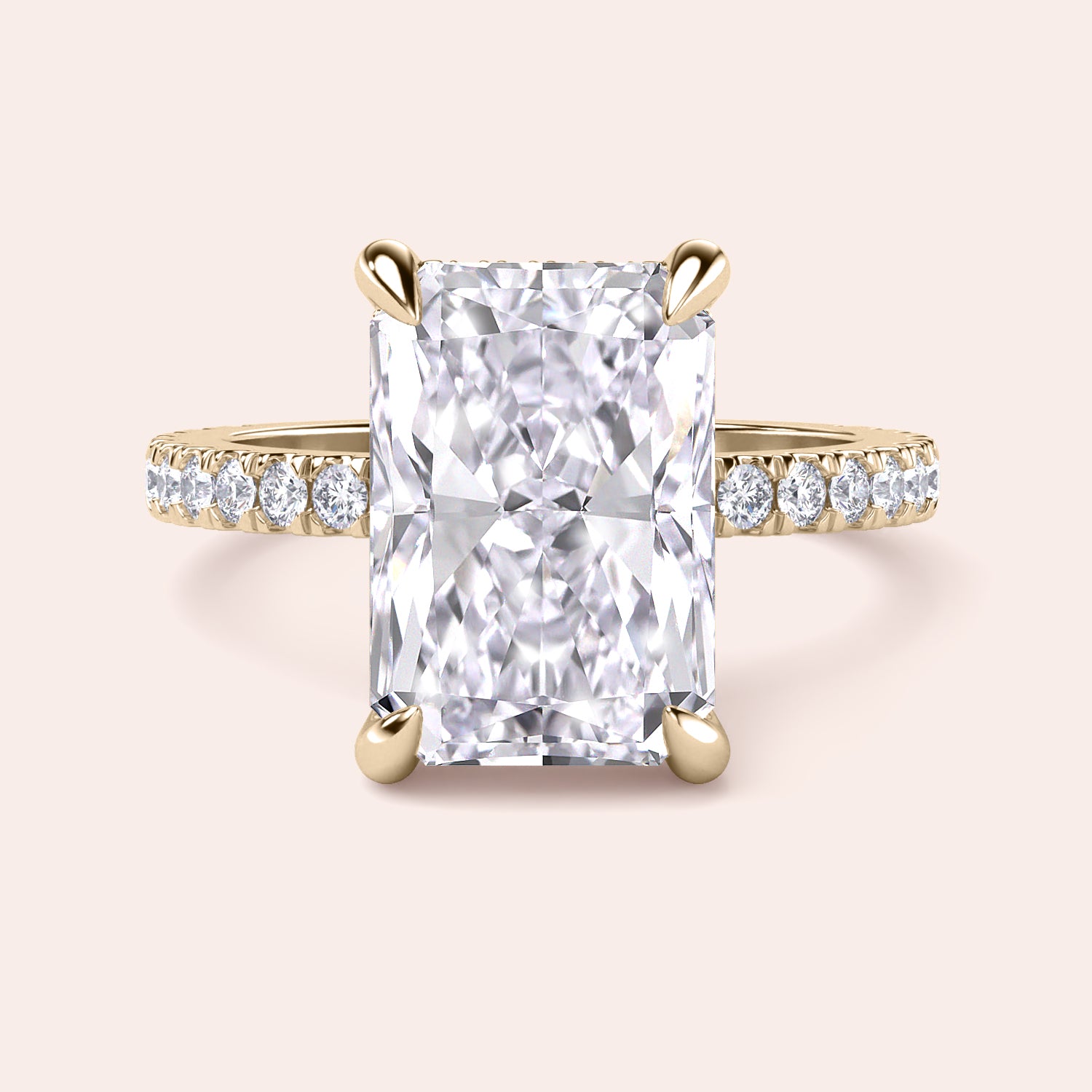 Radiant-cut diamond engagement ring with side stone accents in 14K yellow gold, displayed on a neutral background.|
#14KRecycledYellowGold
#18KRecycledYellowGold