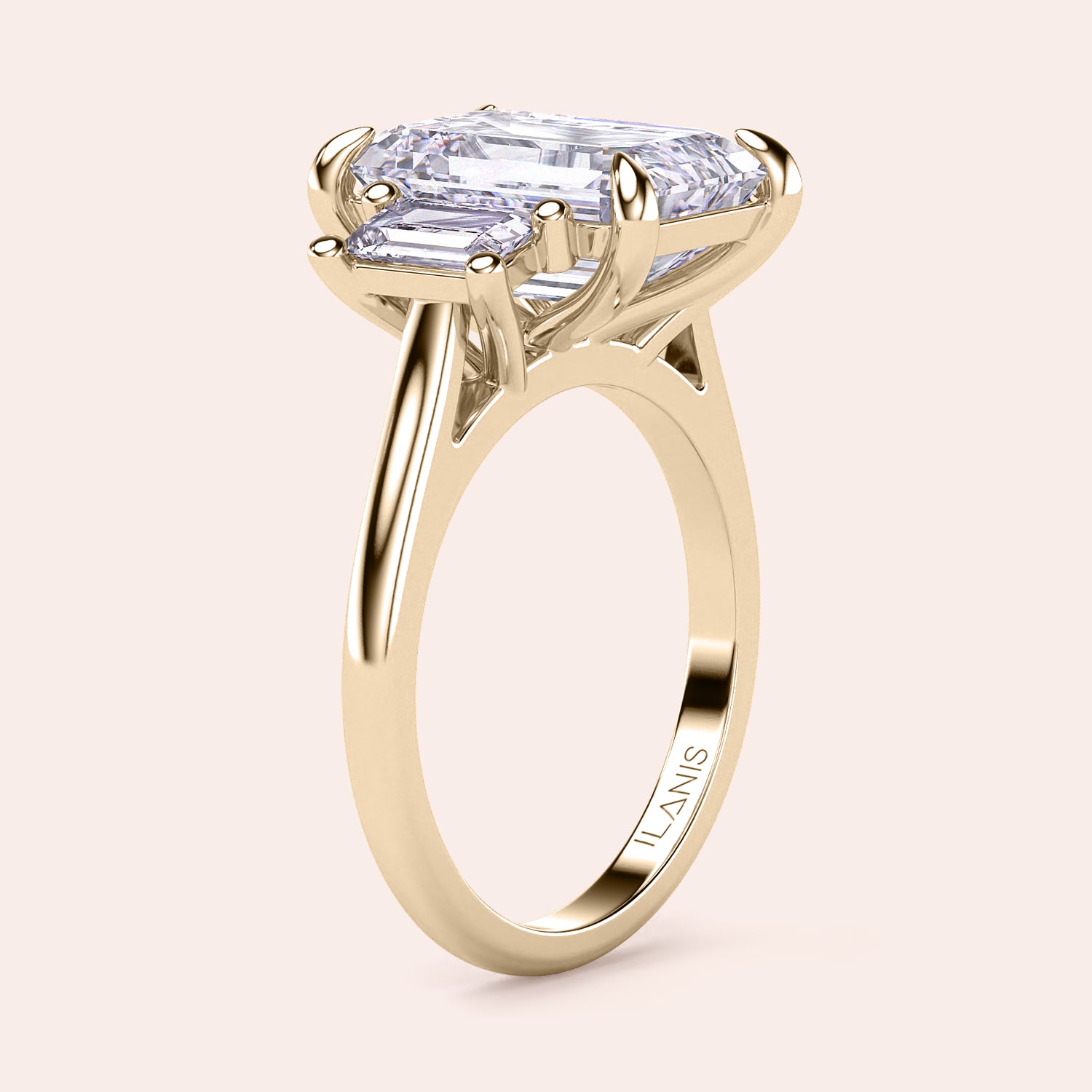 Radiant-cut diamond engagement ring with side stone accents in 14K yellow gold, displayed on a neutral background.|
#14KRecycledYellowGold
#18KRecycledYellowGold