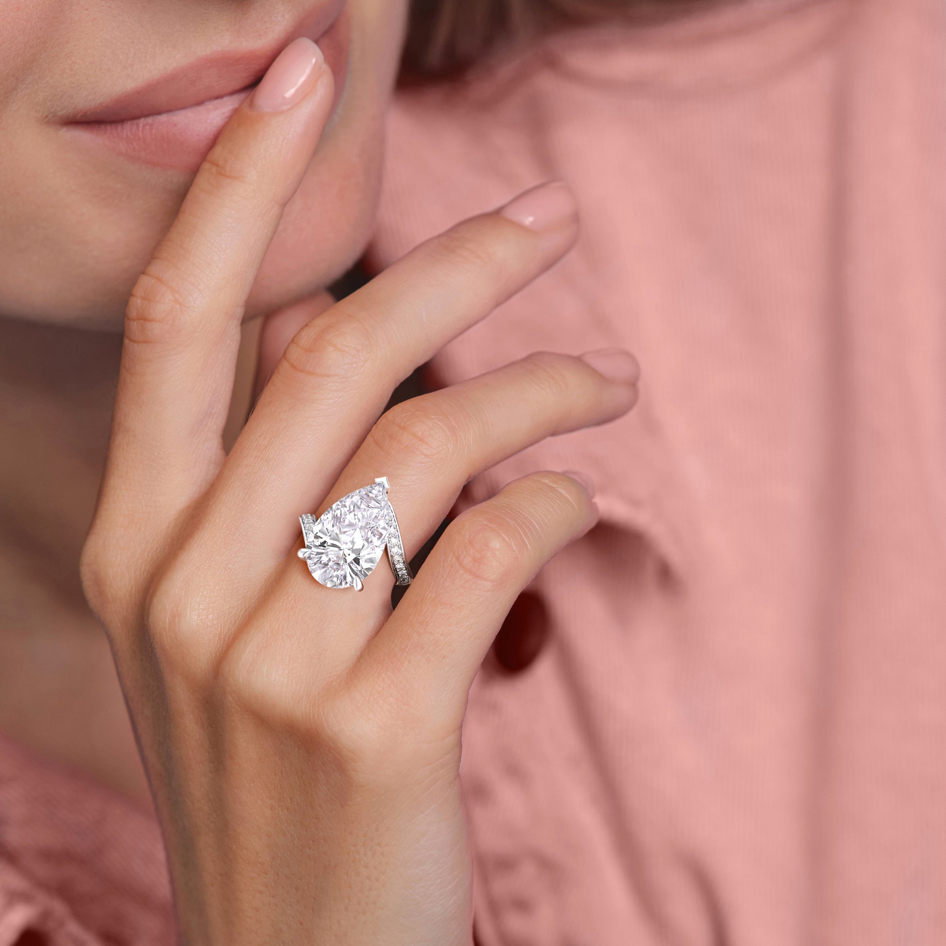 Elegant pear-shaped diamond engagement ring in 14K/18K gold or platinum, featuring a sparkling diamond-studded band.|
#14KRecycledWhiteGold
#18KRecycledWhiteGold
#Platinum