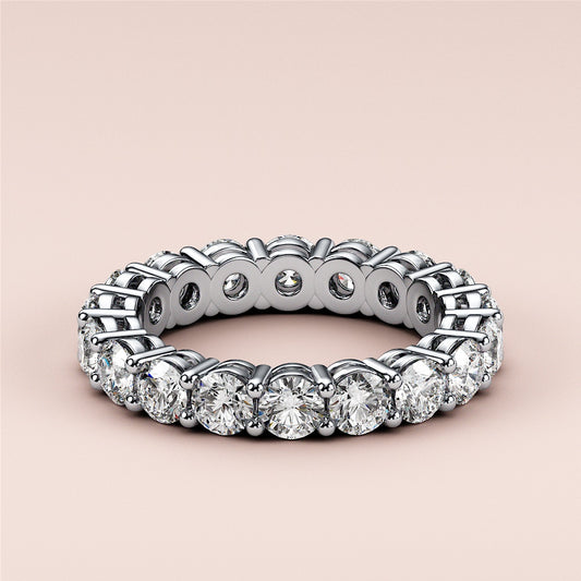 Elegant 14K or 18K gold or platinum wedding band featuring a continuous circle of diamonds, perfect for eternity and daily wear.