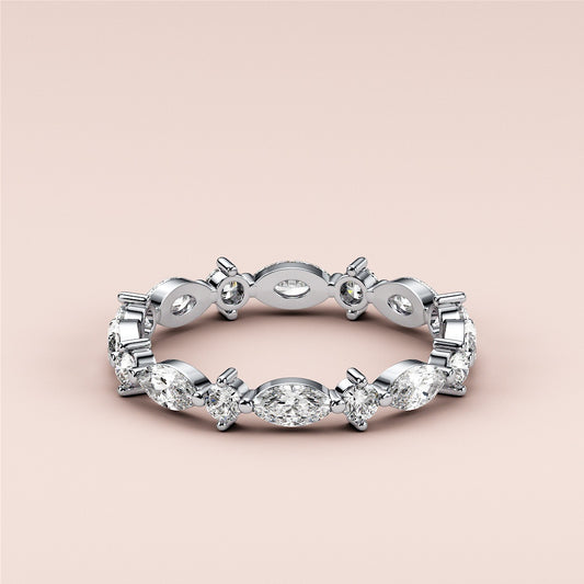 Elegant 14K or 18K white gold eternity band with marquise and round diamonds, ideal for weddings and anniversaries.