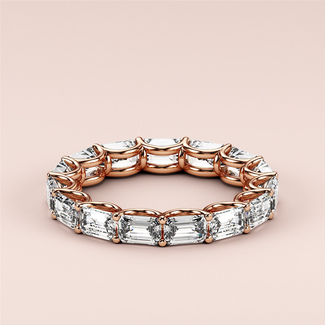 Elegant 14K rose gold eternity wedding band featuring emerald-cut diamonds, showcasing exquisite design and craftsmanship. |
 
 
 
 
 #14KRecycledRoseGold
 #18KRecycledRoseGold
