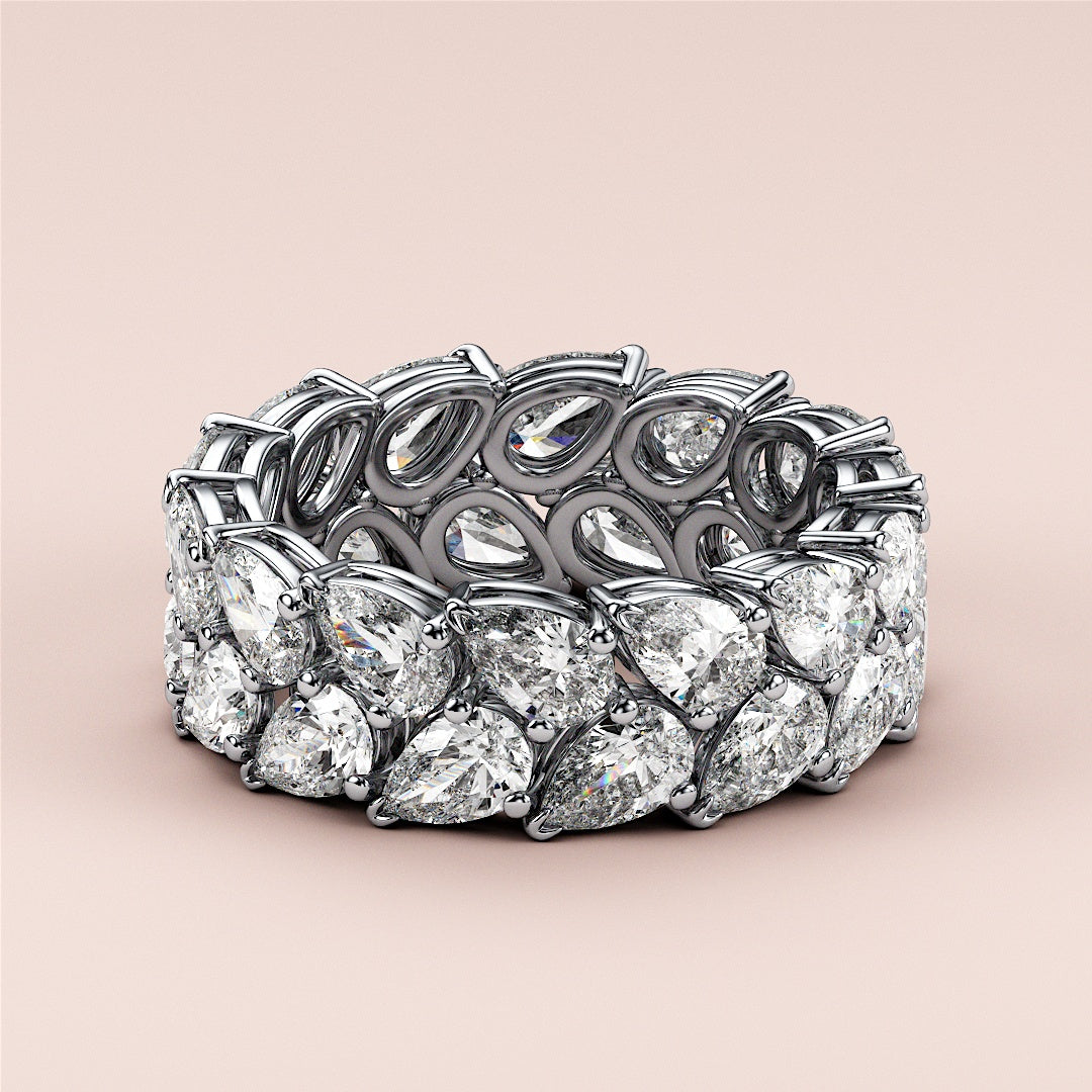 Elegant 14K or 18K gold or platinum eternity wedding band set with brilliant oval-shaped diamonds on a neutral background. |
 #14KRecycledWhiteGold
 #18KRecycledWhiteGold
 
 
 
 
 #Platinum