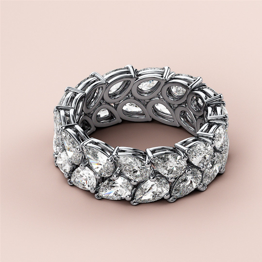 Elegant 14K or 18K gold or platinum eternity wedding band set with brilliant oval-shaped diamonds on a neutral background. |
 #14KRecycledWhiteGold
 #18KRecycledWhiteGold
 
 
 
 
 #Platinum