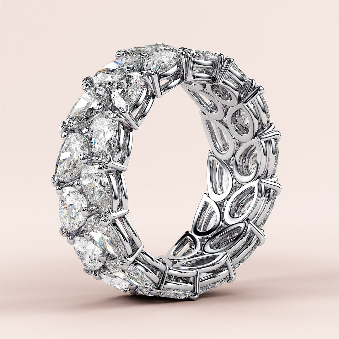 Luxury pear-shaped diamond eternity ring in 14K or 18K white gold, featured in a close-up shot for wedding band selection. |
 #14KRecycledWhiteGold
 #18KRecycledWhiteGold
 
 
 
 
 #Platinum