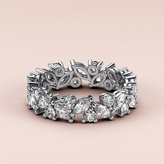 Stunning 14K or 18K gold platinum eternity band with pear, marquise, and round diamonds for the perfect wedding ring.