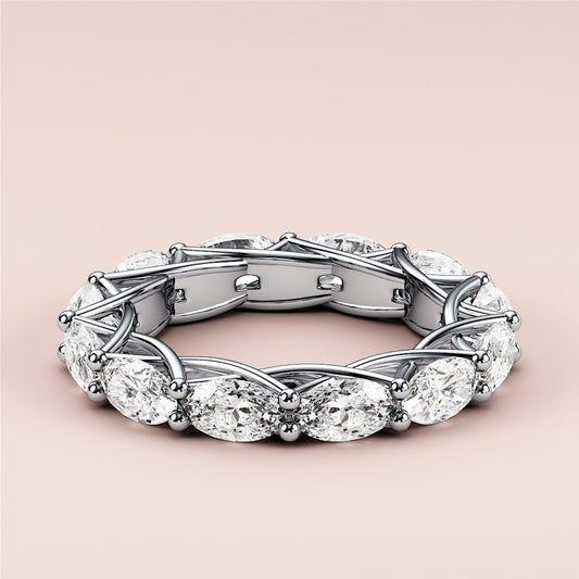 Elegant white gold wedding band featuring an oval eternity trellis design, available in 14K or 18K gold or platinum.