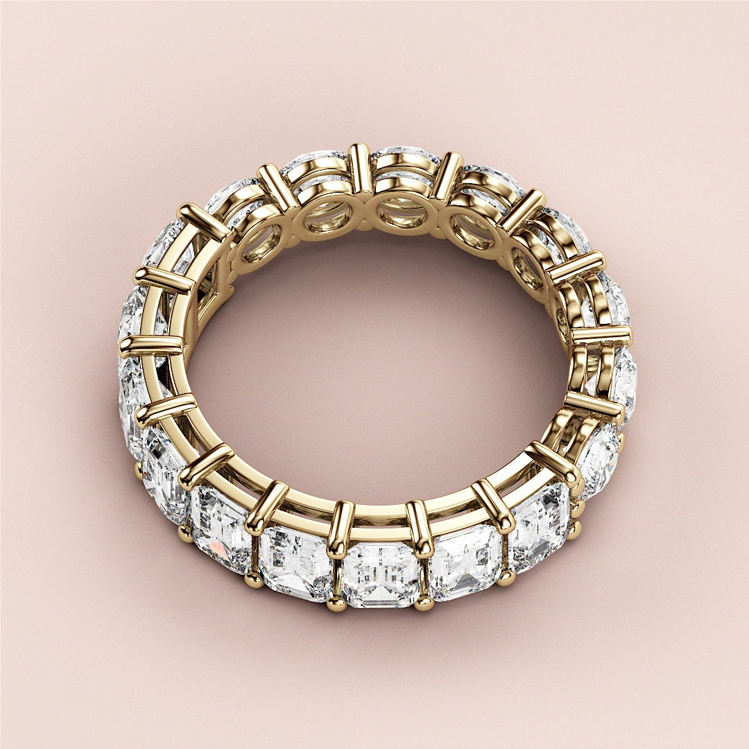 Elegant 14K yellow gold eternity band with emerald-cut diamonds in a luxurious design, perfect for weddings and special occasions. |
 
 
 #14KRecycledYellowGold
 #18KRecycledYellowGold