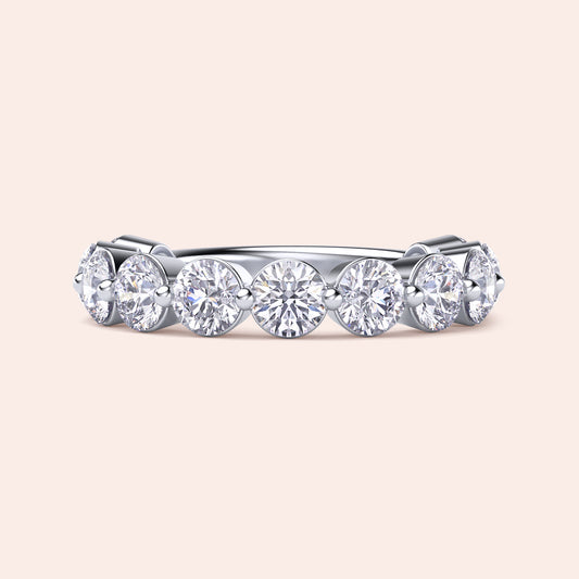 Elegant white gold wedding band featuring round brilliant-cut diamonds, available in 14K, 18K, and platinum settings.
