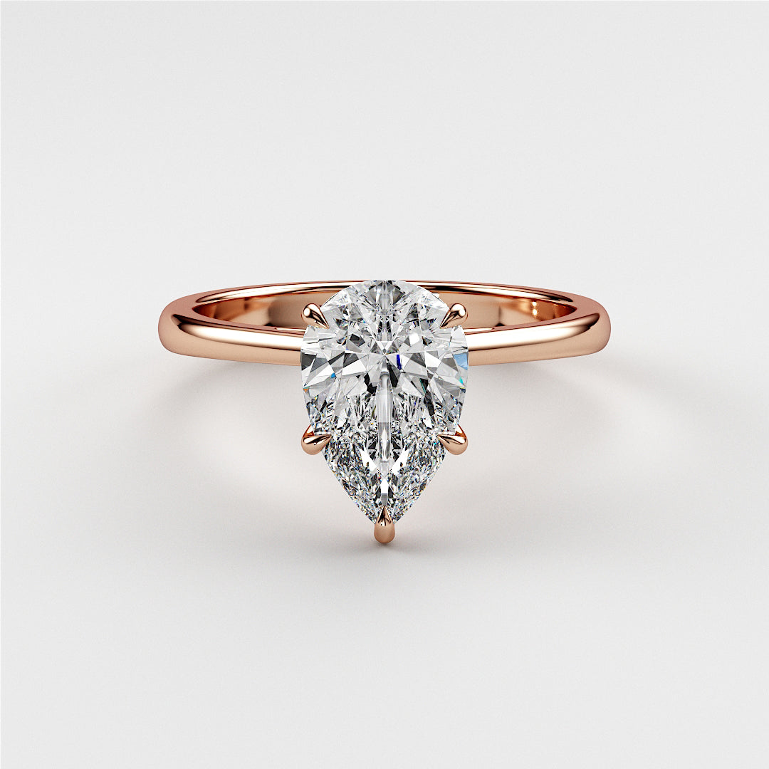 Exquisite rose gold pear-shaped diamond engagement ring, available in 14K, 18K, or platinum setting.|
#14KRecycledRoseGold
#18KRecycledRoseGold