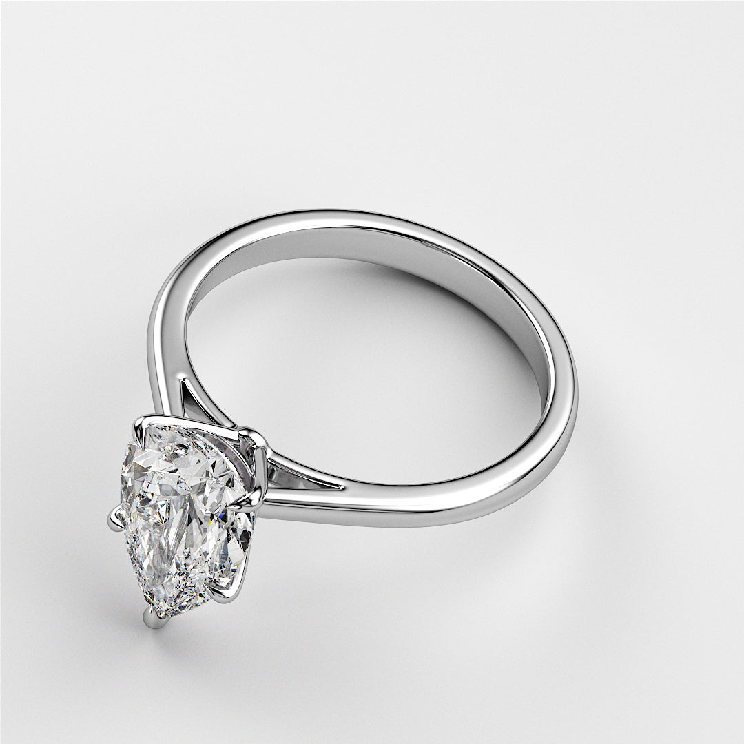 Elegant pear-shaped diamond engagement ring in 14K or 18K white gold, exuding timeless sophistication and classic romance.|
#14KRecycledWhiteGold
#18KRecycledWhiteGold
#Platinum