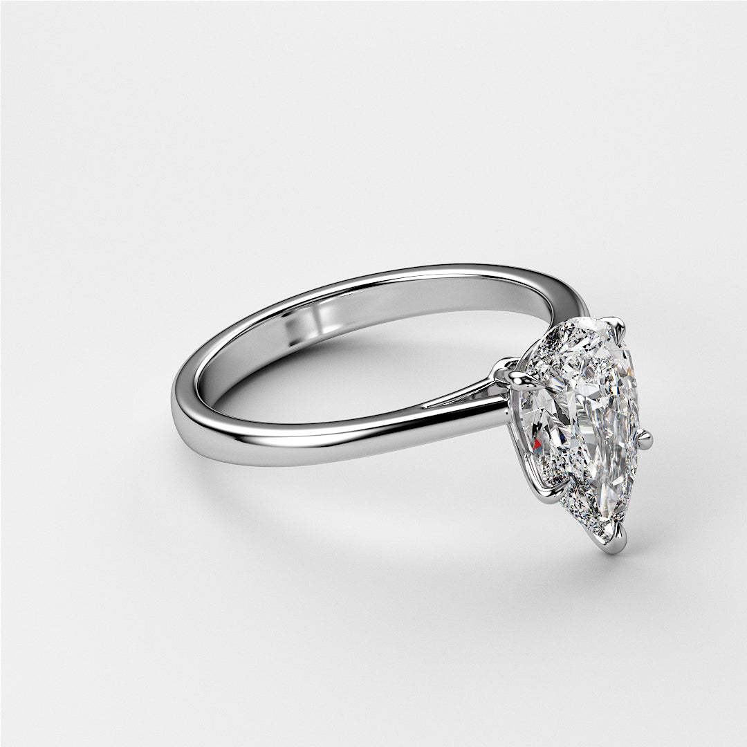 Elegant pear-shaped diamond engagement ring in 14K gold, perfect for special occasions and timeless elegance.|
#14KRecycledWhiteGold
#18KRecycledWhiteGold
#Platinum